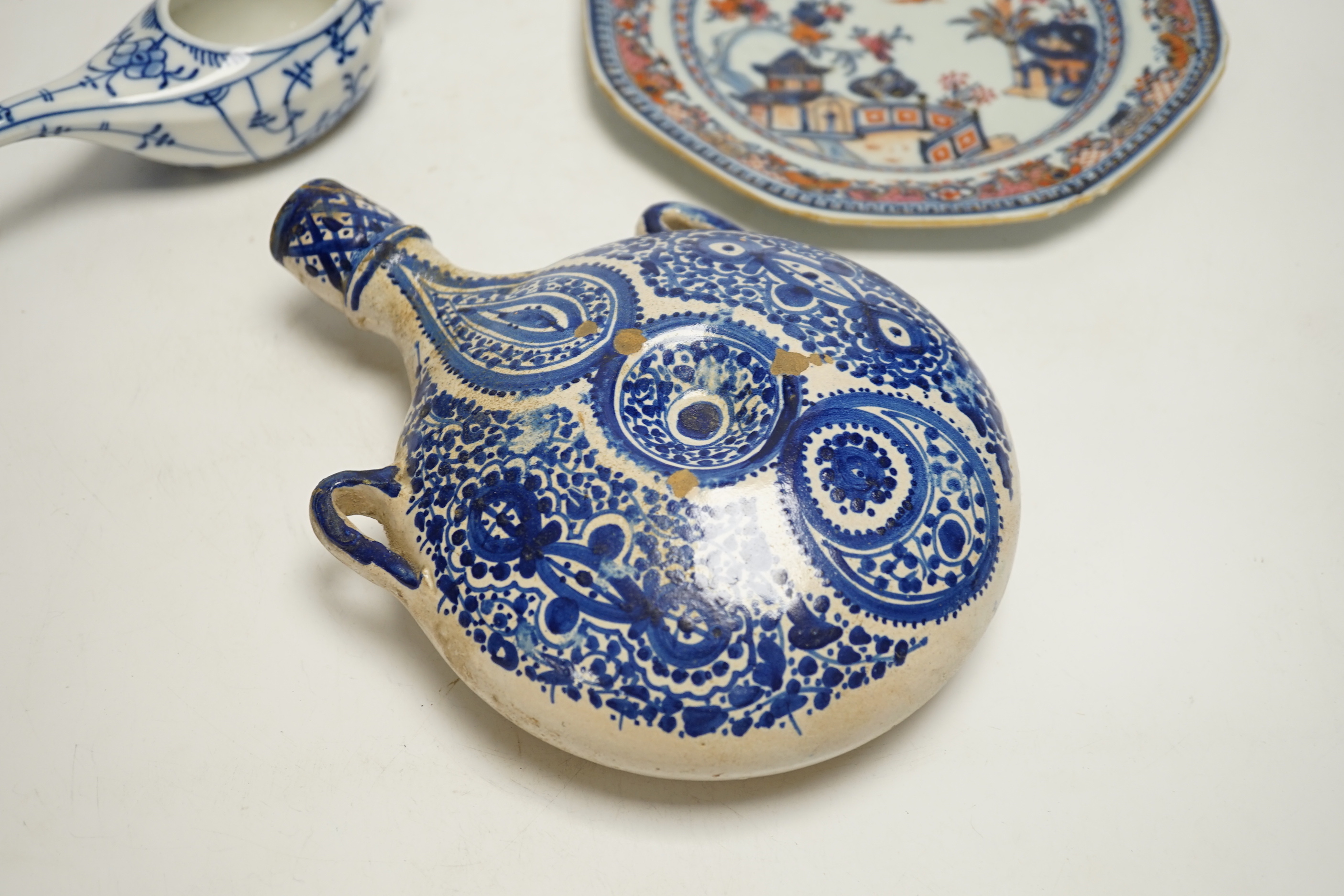 An 18th century Chinese export dish, a Iznik style flask and an onion pattern piece